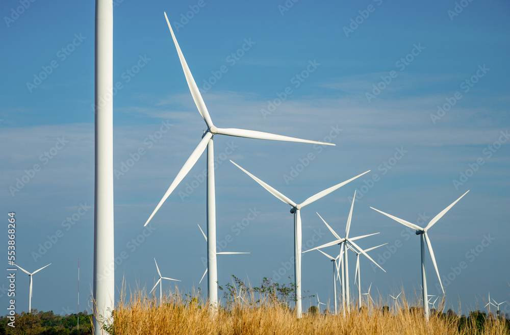 Local eco friendly wind farm. Wind turbines generating electricity.