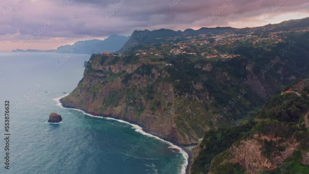 Aerial view of Madeira island green hills and coastline at sunset Aerial view of Madeira island green hills and coastline at sunset