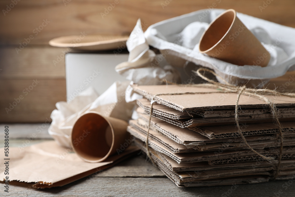 Different waste paper on wooden table, closeup. Space for text Different waste paper on wooden table, closeup. Space for text