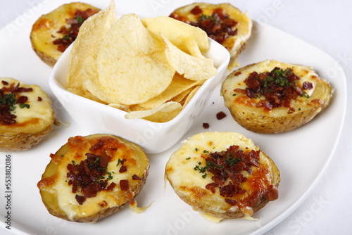 Loaded baked potato with bacon and cheese  with chips