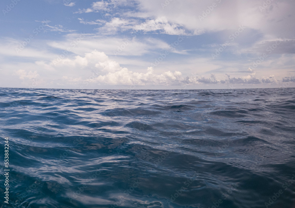 calm ocean surface and cloudy sky indonesia