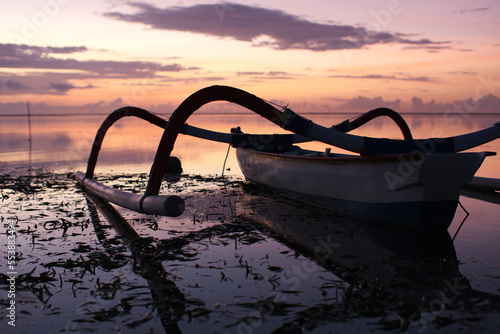 Trditional Boat faces Sunrise in Sanur Bali