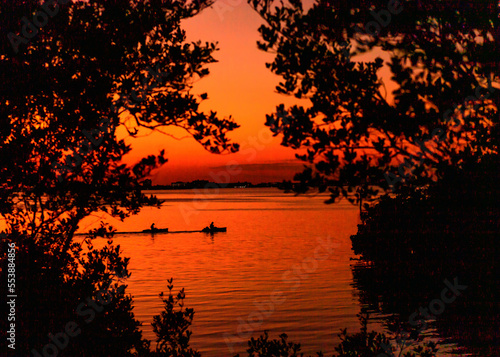 Kayaks at sunset ocean landscape