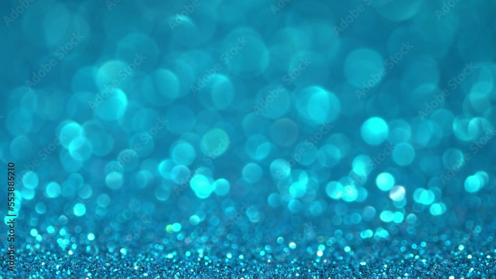 Blue Christmas background. Shiny blue surface rotates. Magic bokeh background