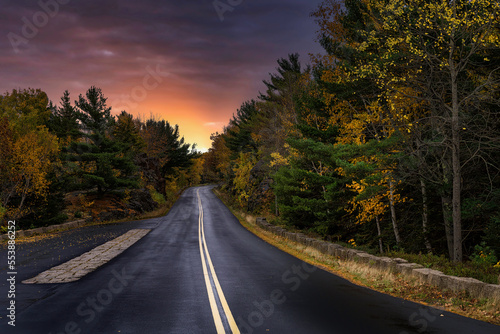 2022-12-14 A LONELY ROAD IN MAINE WITH FALL COLORS AND A BEAUTIFUL RED SKY NEAR ACADIA NATIONAL PARK