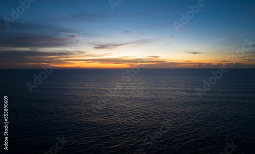 Aerial view Nature beautiful Light Sunset or sunrise over sea surface, Colorful Dramatic majestic scenery Sky with Amazing clouds in sunset sky cloud background,High angle view © panya99