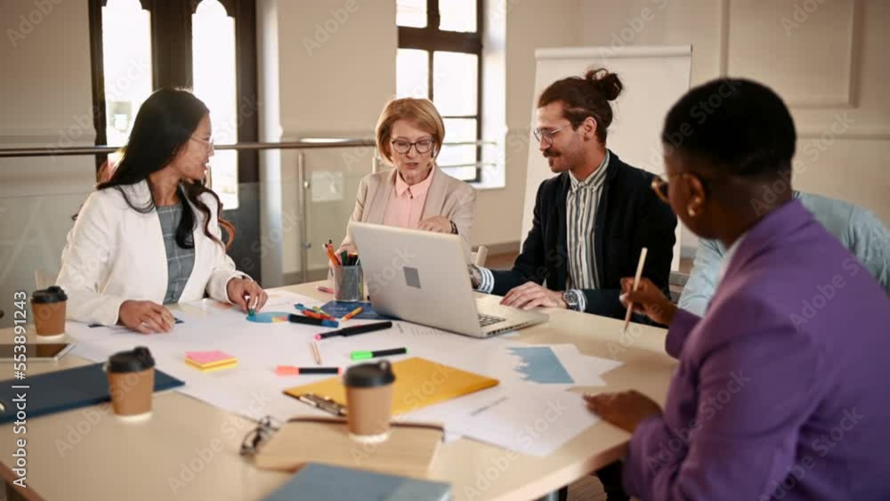 Multiracial group of people having a meeting in the office Multiracial group of people having a meeting in the office