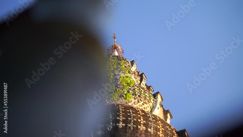 Slow motion slider looking up toward Wat Welu Wanaram Pagoda in Thailand photo