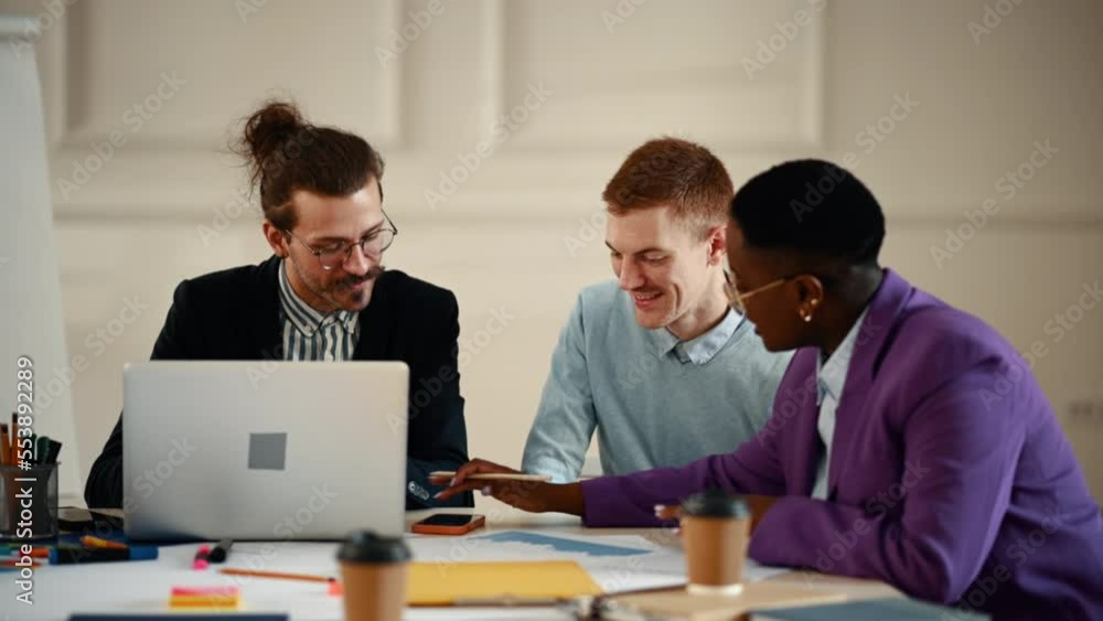Multiracial group of people having a meeting in the office Multiracial group of people having a meeting in the office