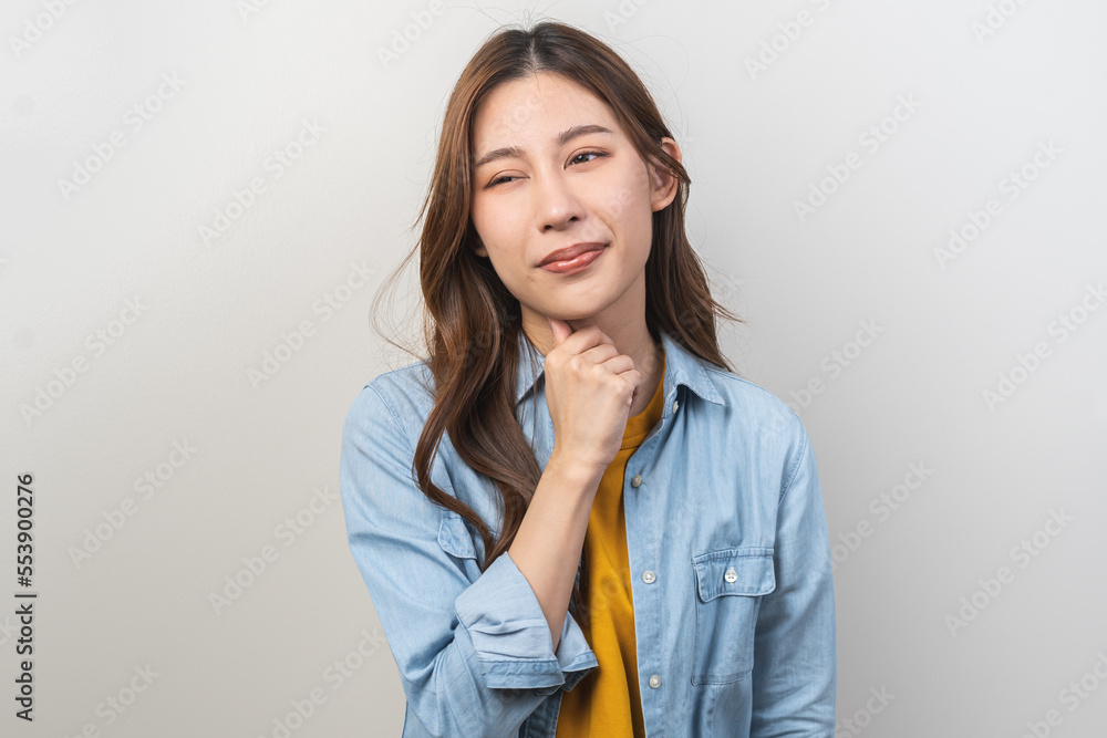 Sickness in inflaming asian young woman, girl use hand check self touch at sore throat, pain thyroid gland on neck or disease reflux, acid of suffer people on wall background. Medical and healthcare. Sickness in inflaming asian young woman, girl use hand check self touch at sore throat, pain thyroid gland on neck or disease reflux, acid of suffer people on wall background. Medical and healthcare.
