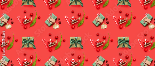 Many Christmas gifts and decor on red background. Pattern for design
