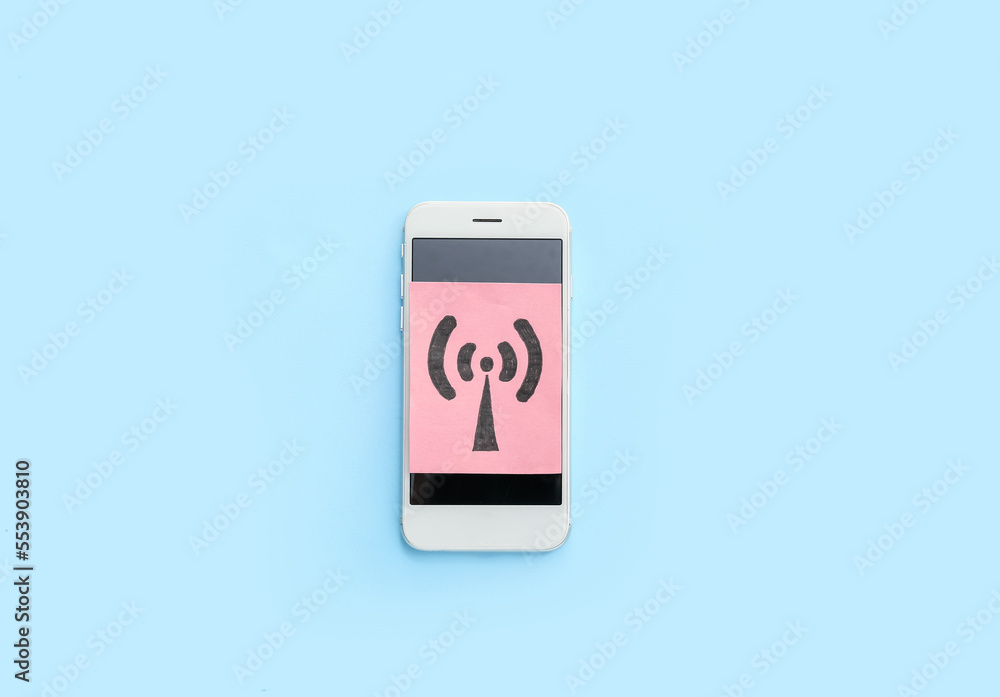 Mobile phone and paper sheet with WiFi symbol on color background Mobile phone and paper sheet with WiFi symbol on color background