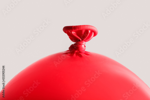 Inflated red balloon with a...