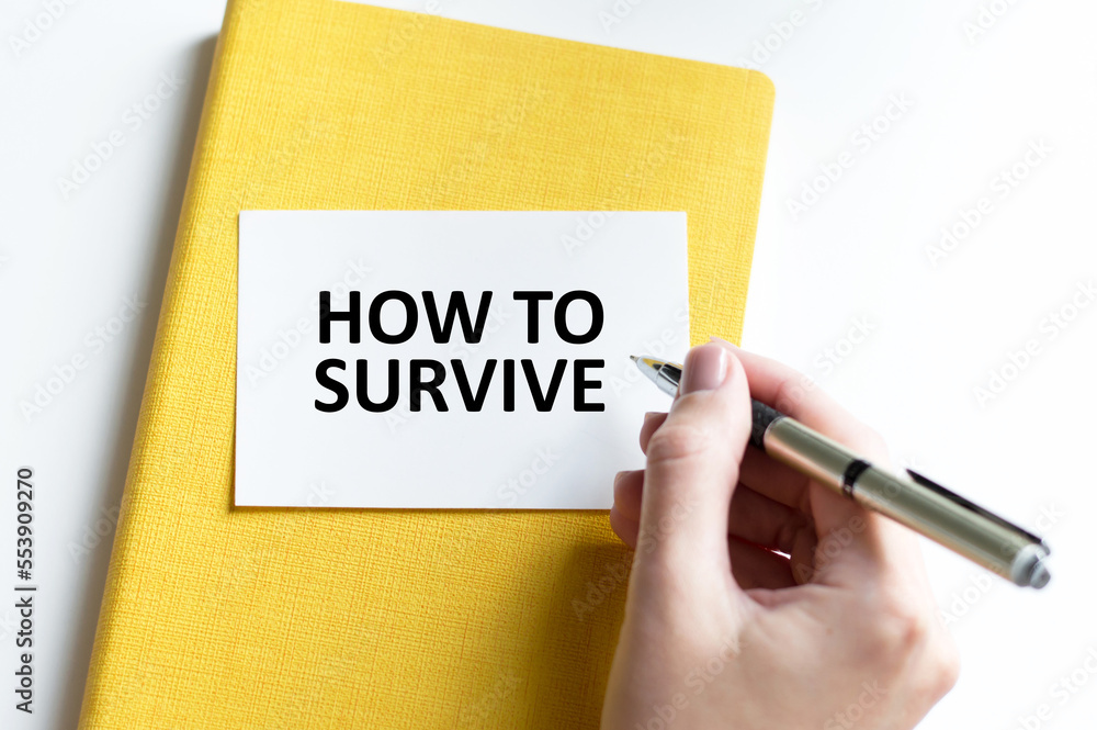 How to survive text on the notebook with businessman's hands How to survive text on the notebook with businessman's hands