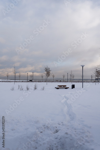 View to baltic sea and clouded sky. Fresh white snow during winter time. Reidi tee, Tallinn, Estonia, Europe. December 2022