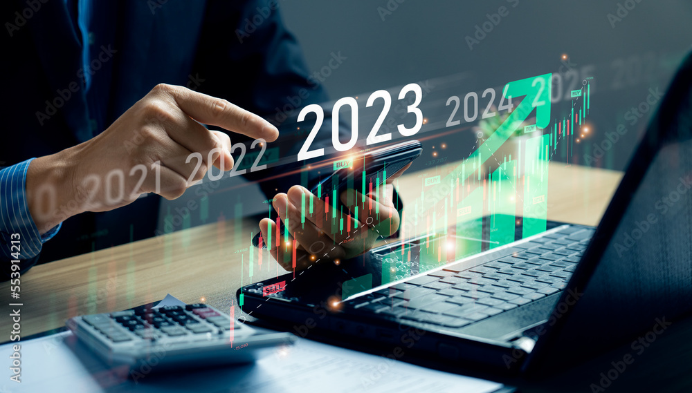stock market trends for 2023, Businessman calculating financial data for long term investments. Analytical businessman planning business growth 2023 with future economic growth arrow graphic. strategy - obrazy, fototapety, plakaty 