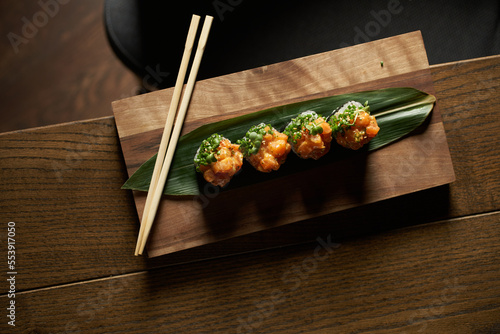 Set of different sushi and rolls wood desk top view nature food chopstick japan traditional fish tasty closeup