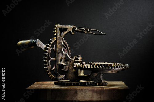 Metal potato peeler gears and  sprockets in machine, old and rusted closeup still life with beautiful textures and shape. Fine art