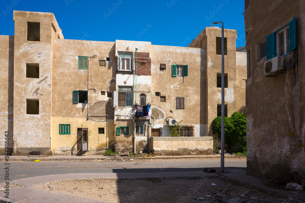 Street view in Hurghada, Shabby buildings where ordinary people live in Egypt, Third world cheap accomodation
