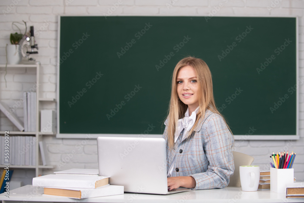 Young teacher. High school student learning english or mathematics in class. Young teacher. High school student learning english or mathematics in class.