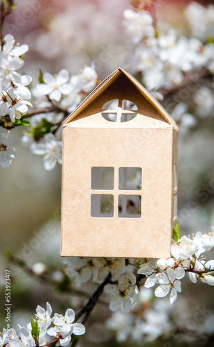 Wallpaper Mural symbol of the house among the white cherry blossoms
 Torontodigital.ca