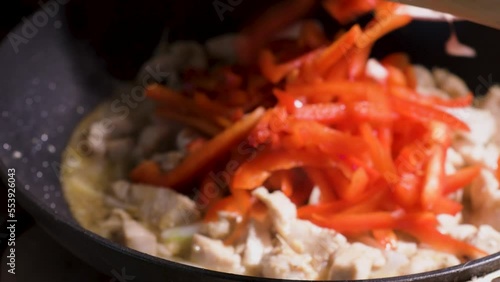 Wallpaper Mural Stir-Fried Chicken cooking adding paprika in pan to mate chp suey, close up Torontodigital.ca
