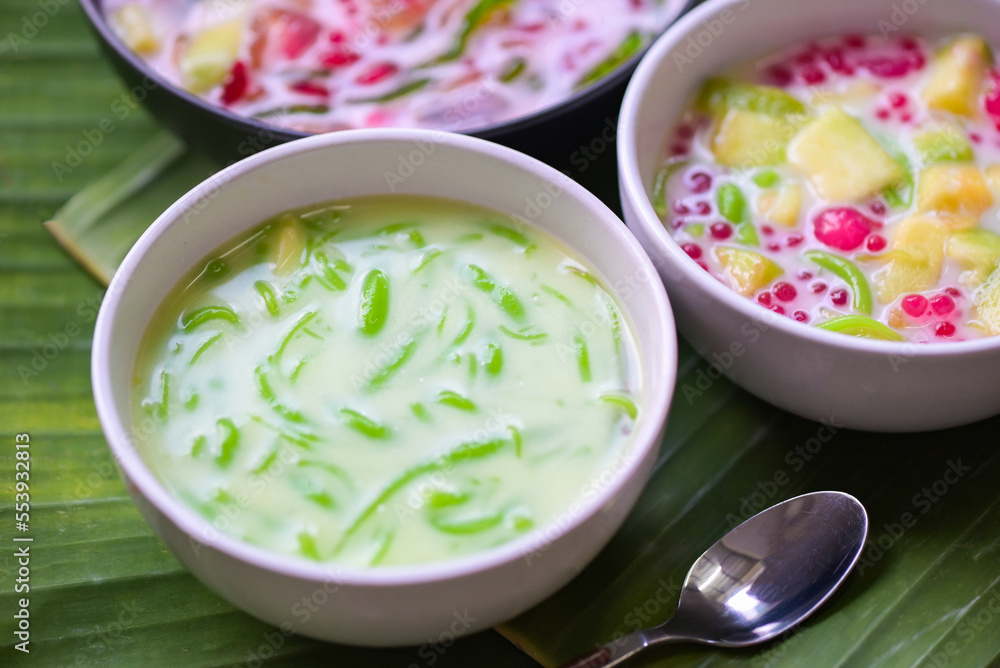 Thai dessert - Thai rice flour pandan leaf with coconut milk and syrup sweets dessert on white bowl, Asian food Thai dessert - Thai rice flour pandan leaf with coconut milk and syrup sweets dessert on white bowl, Asian food