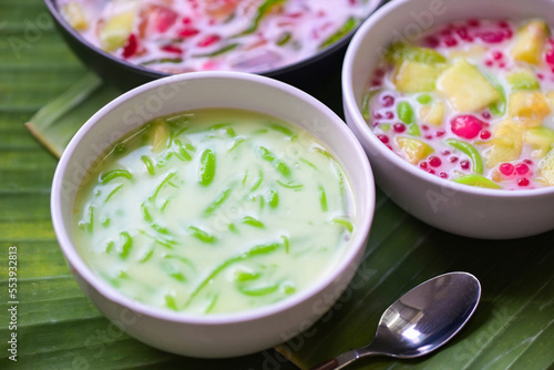 Thai dessert - Thai rice flour pandan leaf with coconut milk and syrup sweets dessert on white bowl  Asian food