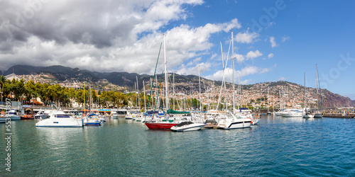 Marina with boats in Funchal panorama on Madeira island in Portugal