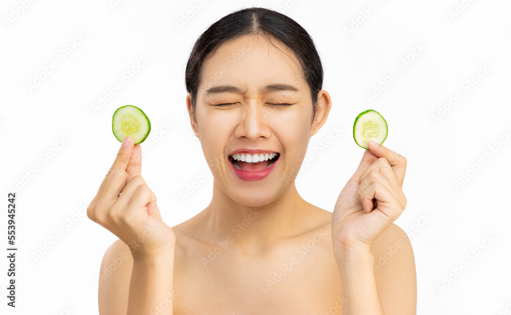 Happy smiling girl using cucumber for Healthy beauty treatment and self skin care lifestyle concept white background. Happy smiling girl using cucumber for Healthy beauty treatment and self skin care lifestyle concept white background.