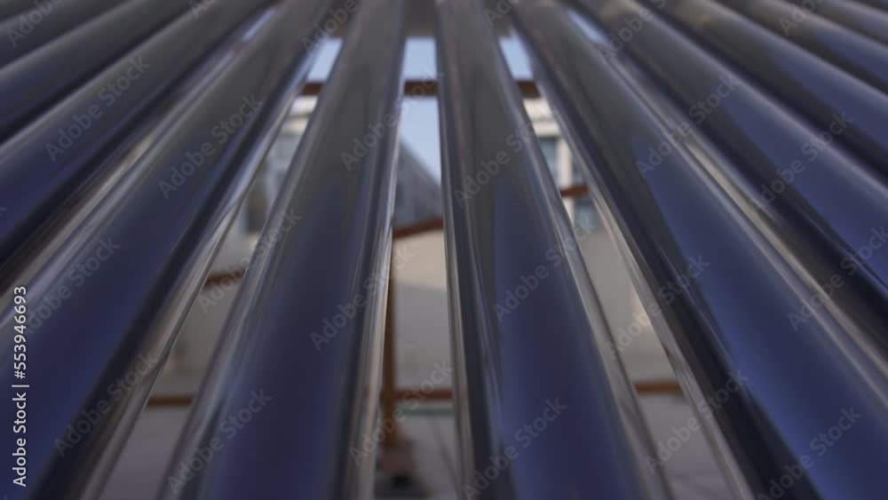 Solar Water Heater Unit Boiler On The Roof of the House. Solar Water Heating System on Terrace. Solar Water Heater Unit Boiler On The Roof of the House. Solar Water Heating System on Terrace.