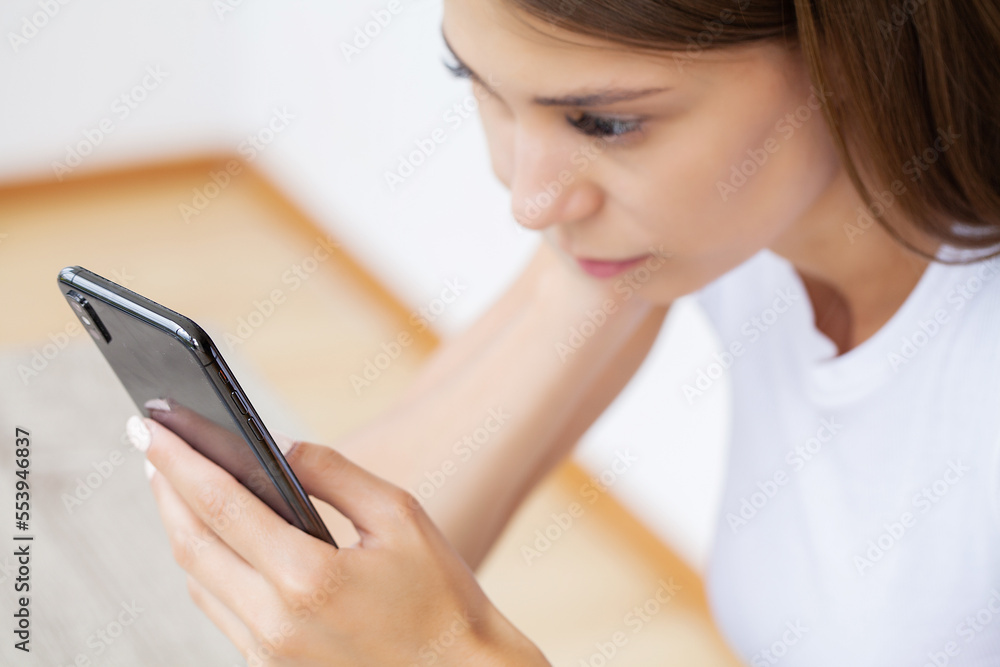 Woman holding smart phone chatting in social media Woman holding smart phone chatting in social media