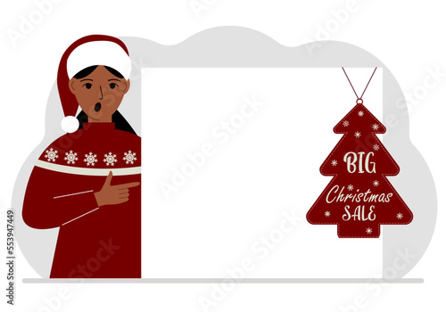 A woman near a large white sheet of paper with a big sale label on it. New Year and Christmas sales.