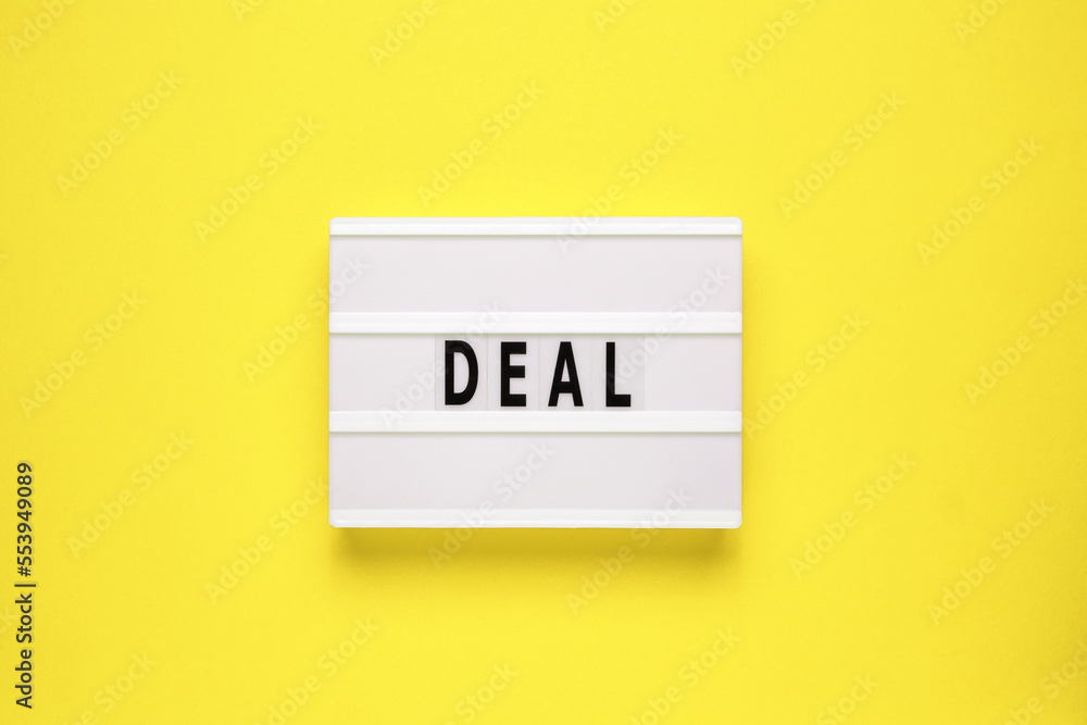 Lightbox with word deal on yellow background. Business and Deal concept. Copy space. Lightbox with word deal on yellow background. Business and Deal concept. Copy space.