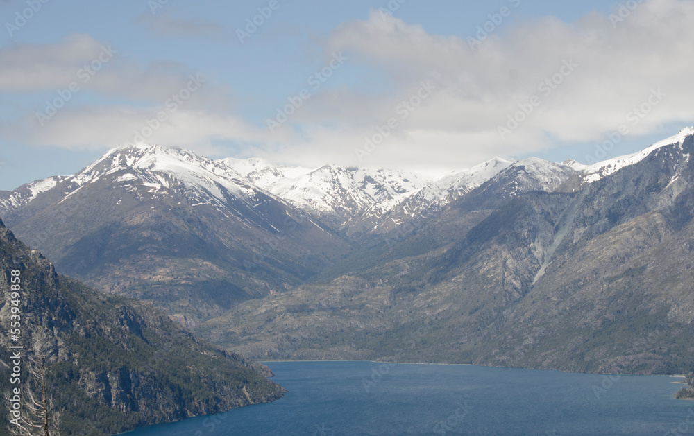 panoramic view of epuyen lake with mountains of the andes of
