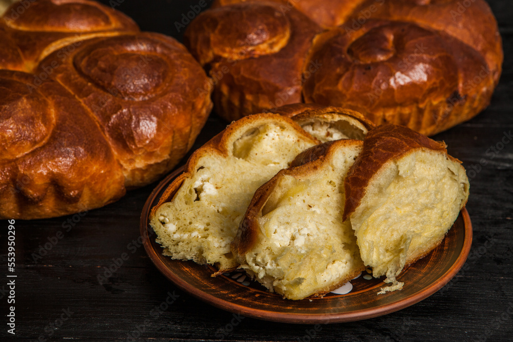 Fresh bread from the oven. Traditional cheese pie from Romania called Saralie. Homemade bread made from white wheat flour. Fresh bread from the oven. Traditional cheese pie from Romania called Saralie. Homemade bread made from white wheat flour.