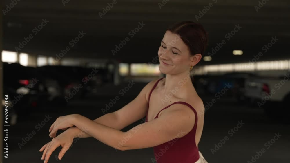 Beautiful ballet dancer in a parkade during the day Beautiful ballet dancer in a parkade during the day