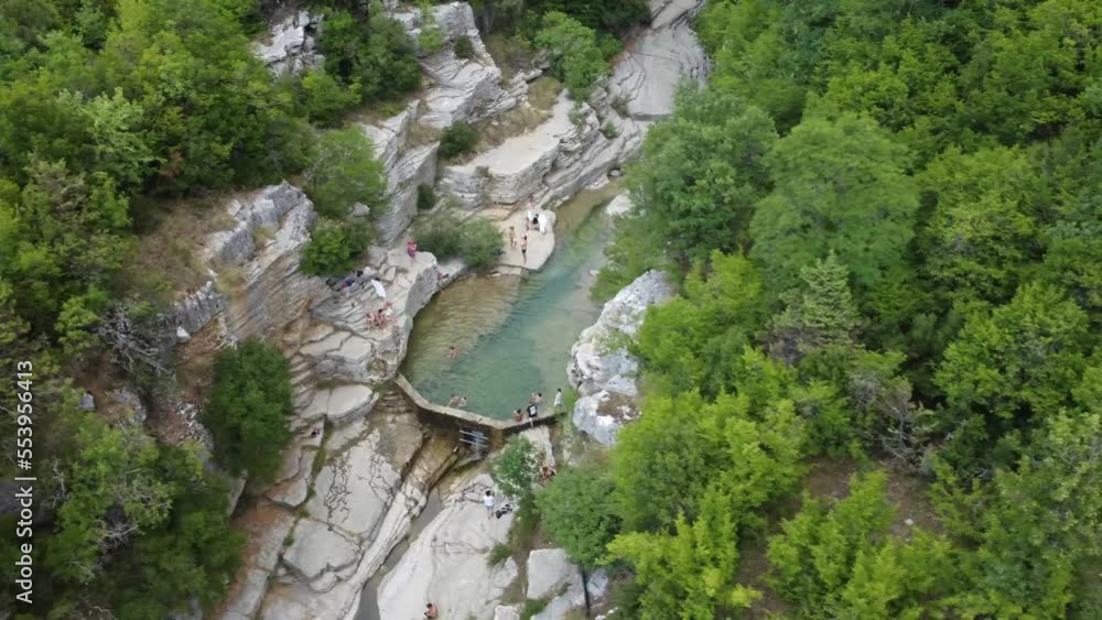 People swimming in the dam river. Holiday destination in Greece. People swimming in the dam river. Holiday destination in Greece.