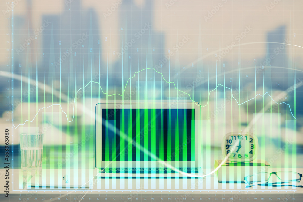 Forex Chart hologram on table with computer background. Double exposure. Concept of financial markets. Forex Chart hologram on table with computer background. Double exposure. Concept of financial markets.