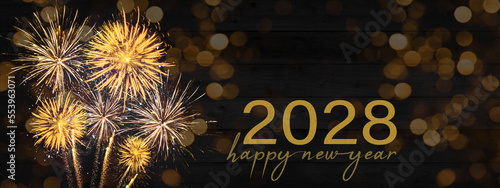 Sylvester, New Year's Eve, Happy new Year 2028 Party, Firework celebration background banner - Golden fireworks and bokeh lights on black wooden wall texture in the night