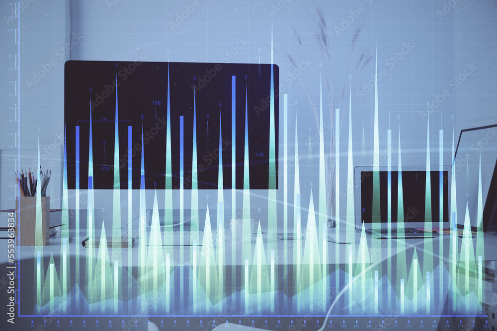 Forex Chart hologram on table with computer background. Double exposure. Concept of financial markets. Forex Chart hologram on table with computer background. Double exposure. Concept of financial markets.