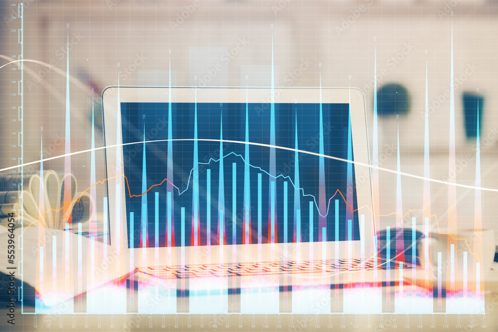 Forex Chart hologram on table with computer background. Double exposure. Concept of financial markets. Forex Chart hologram on table with computer background. Double exposure. Concept of financial markets.