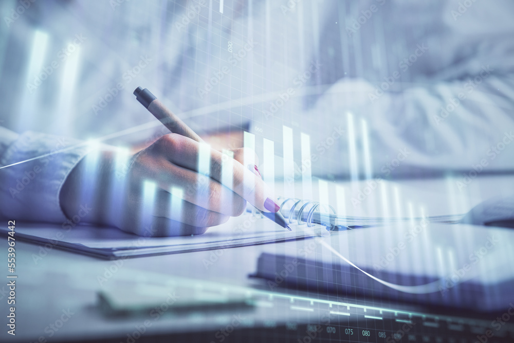 Double exposure of woman's hands making notes with forex graph hologram. Concept stock market analysis. Double exposure of woman's hands making notes with forex graph hologram. Concept stock market analysis.