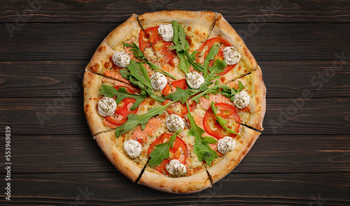 Pizza with salmon, tomatoes, cheese and spices