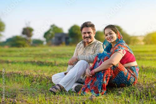 indian farmer with wife at agriculture field.