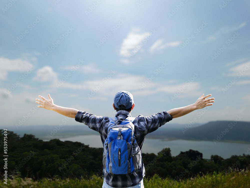 man standing on the mountain adventure tourism mountain climbing back view man standing on the mountain adventure tourism mountain climbing back view