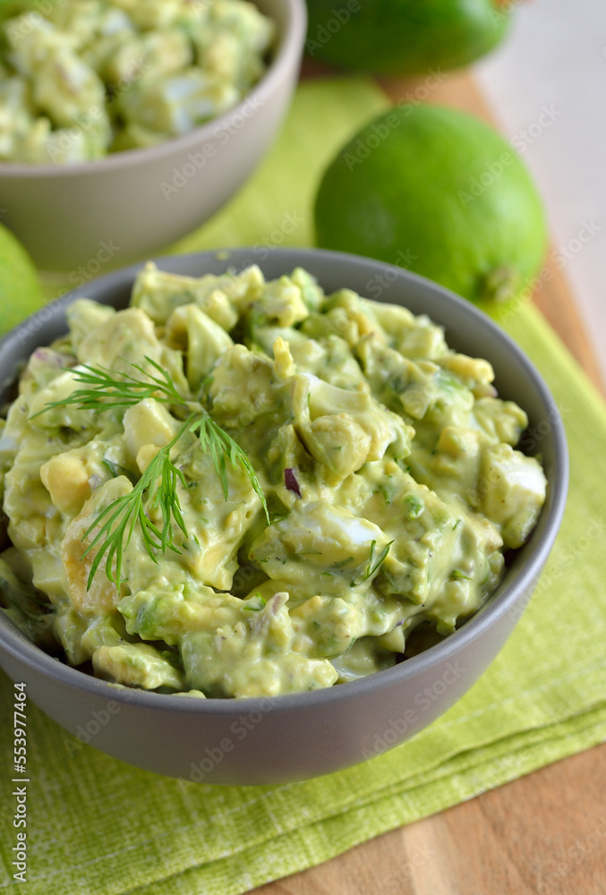 Vegetarian salad with egg and avocado in a bowl