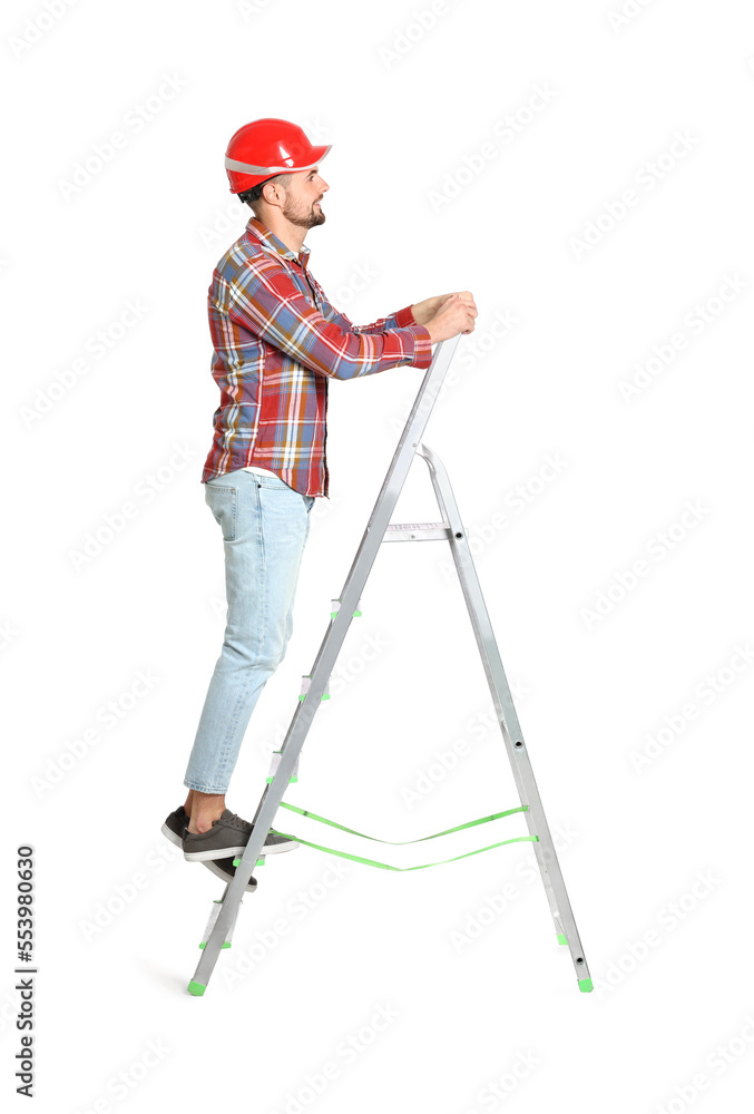 Young handsome man in hard hat climbing up metal ladder on white background Young handsome man in hard hat climbing up metal ladder on white background