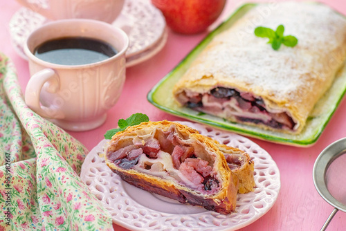 Traditional Austrian apple strudel with cherries and cinnamon