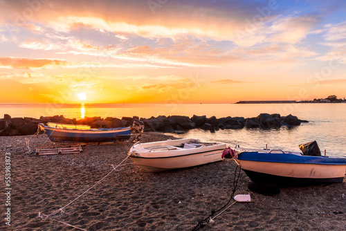 nice old vintage boat on a sea coast with picturesque view on a sunrise in a rocky gulf  landscape of sunset or sunrise bay